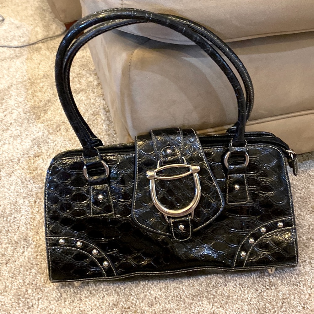 Nice black purse with  beautiful silver accents.